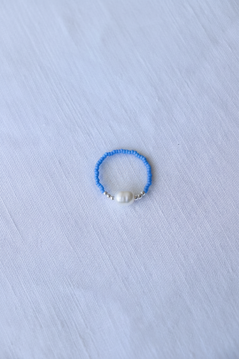 Anello celeste chiaro con perla